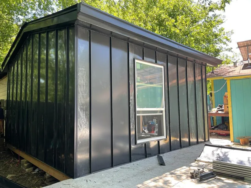 Black standing seam metal wall panels for Metal Roof Installation in Millis