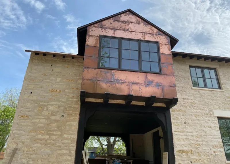 Copper metal panel facade on a stone building for Metal Roof Coating in Millis