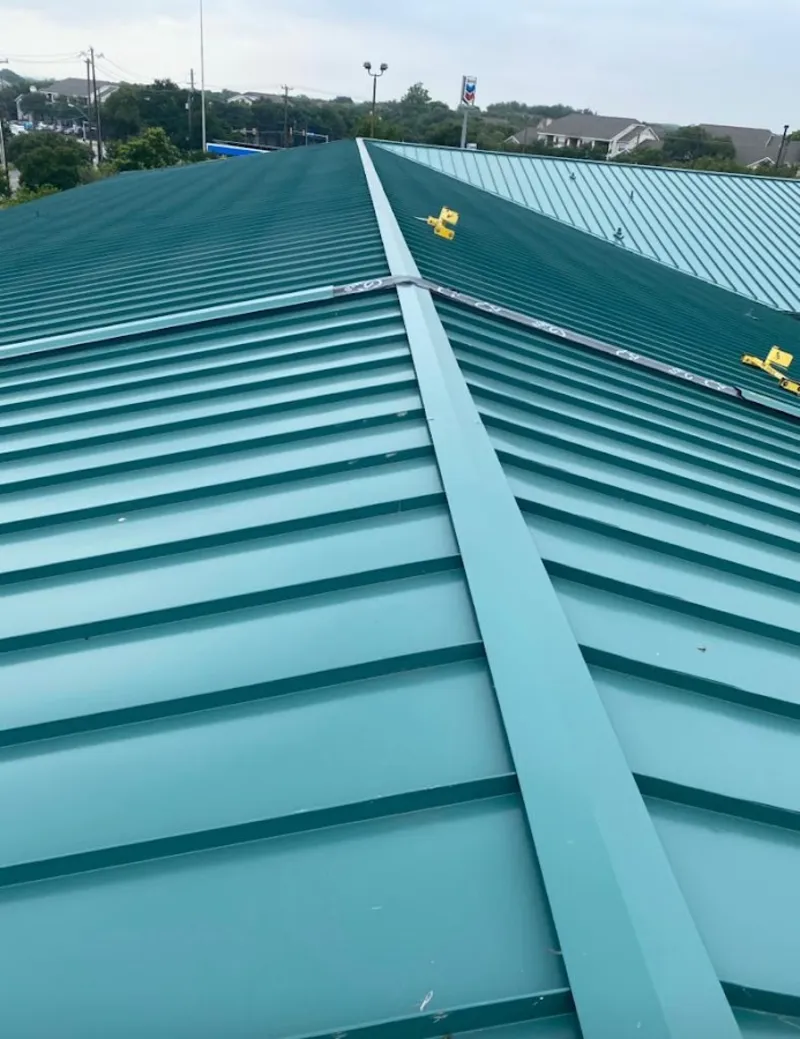 Green commercial metal roof ridge and valley for Metal Roof Repair in Millis