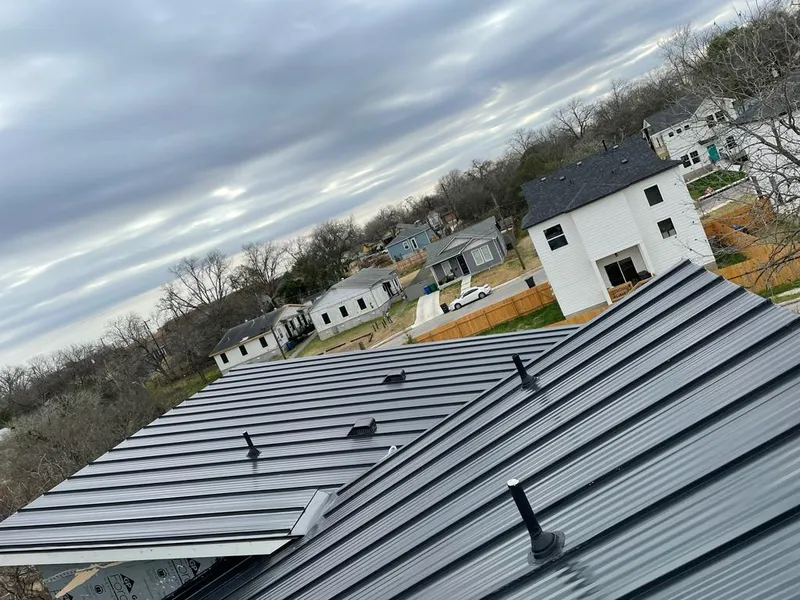 Standing seam metal roof panels with vents for Skylight Repair in Millis